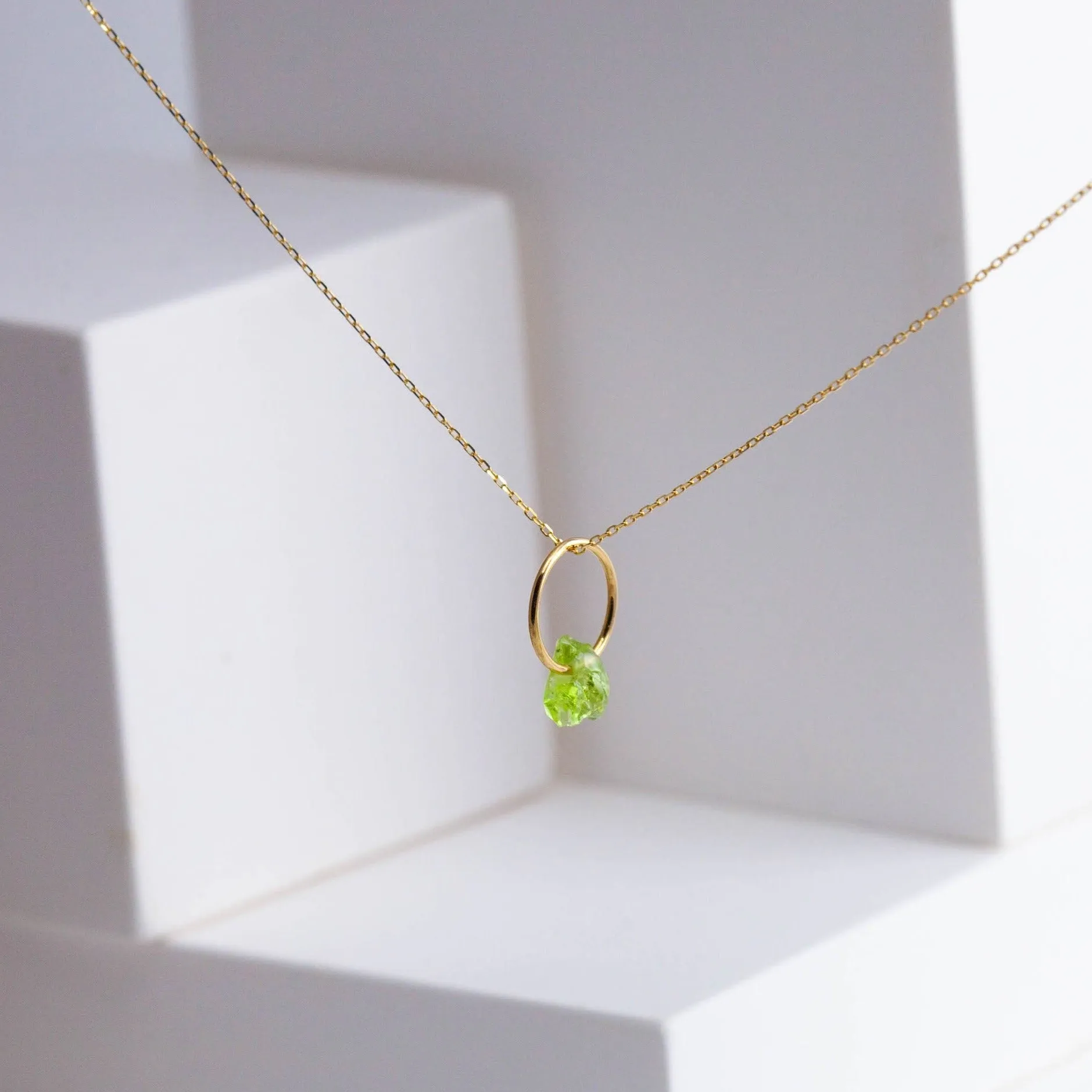 Rough stone peridot pendant